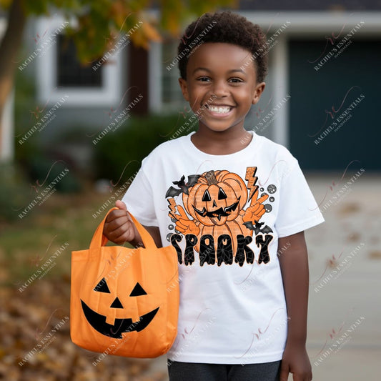 Jack-O-Lantern man with 2 peace signs and the word spooky written underneath. Orange lightning bolts and a black bat are at the top of the design