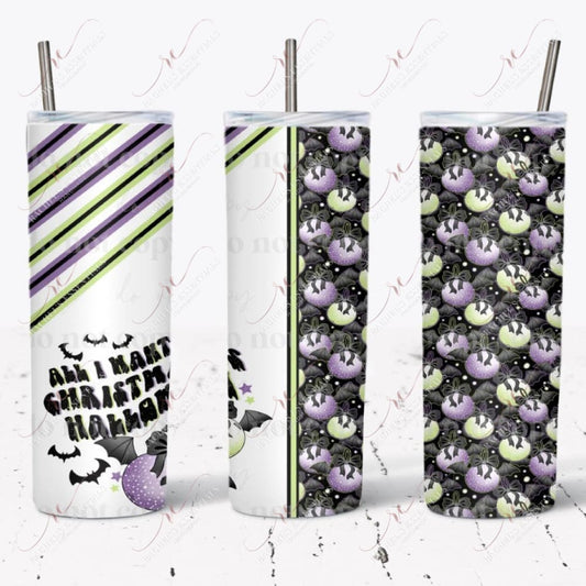Tumbler design feature green and purple ornaments with black bows and black bat wings. The other half of the design is alternating green/black stripes and purple/black stripes with black bats and the wording 'All I want for Christmas is Halloween'.