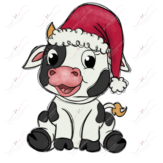 Black and white spotted cow wearing a red santa hat