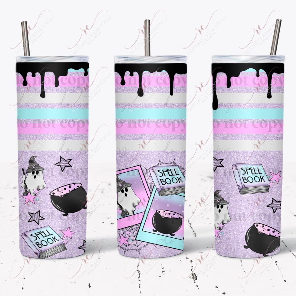 seamless tumbler design featuring a white ghost wearing a witches hat and holding a broom. A spell book and cauldron are in front of him in a polaroid picture. Stars and spiderwebs are scattered throughout the design
