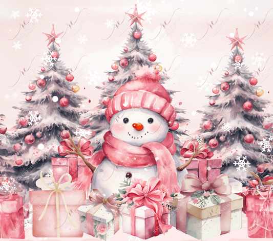 A happy snowman sitting in front of 3 Christmas trees with pink stars and ornaments and pink wrapped presents. The snowman is wearing a pink scarf and toboggan. 